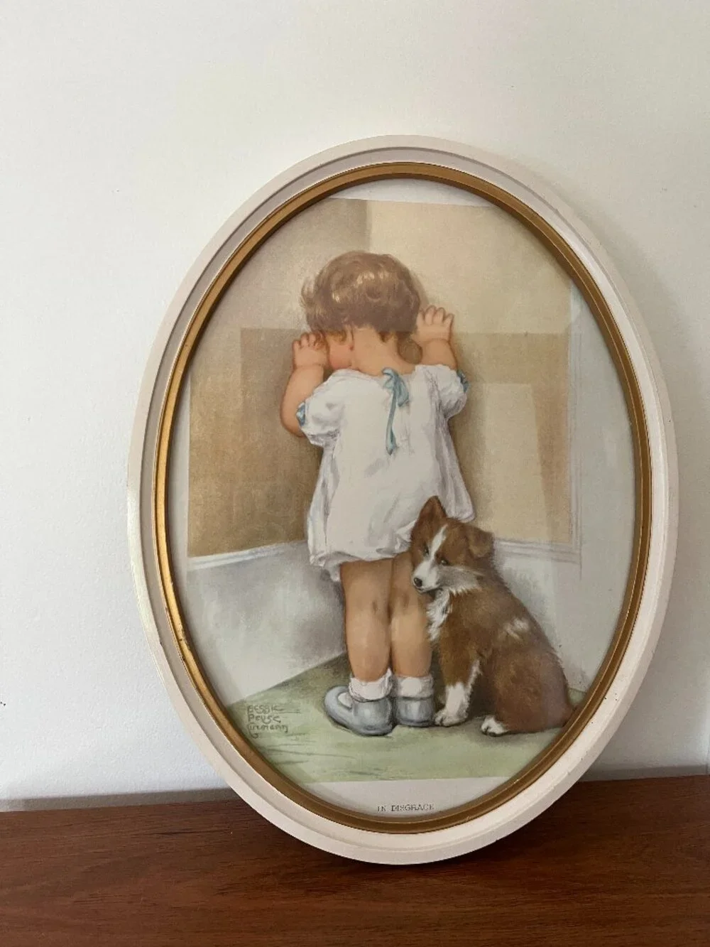 Vintage In Disgrace Oval Framed Print By Bessie Pease Gutmann Girl & Corgi Dog